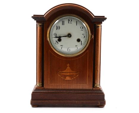 Edwardian inlaid mahogany mantel clock, domed case with brass columns, the movement striking on a gong, 33cm.