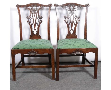 Two pairs of Georgian style dining chairs, one pair with mahogany frames, Chippendale style, green upholstered seat pads, the