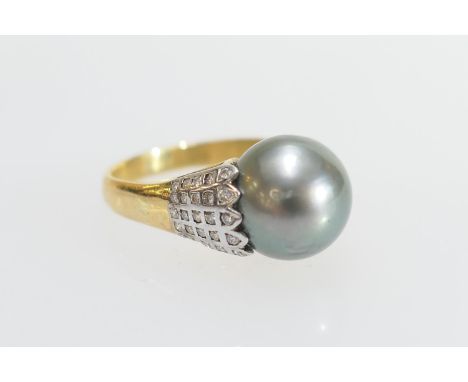 Tahitian pearl and diamond dress ring, the pearl of approx. 11mm diameter, shouldered with tiny round cut diamonfds in a grid