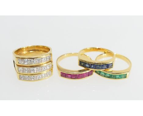 Diamond trinity ring, in 18ct gold, channel set with eighteen well matched princess cut diamonds, colour estimated as K/L, cl