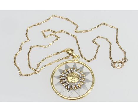 Italian 18ct two colour gold sun pendant, set with tiny round cut diamonds, 35mm diameter, suspended from an unmarked yellow 