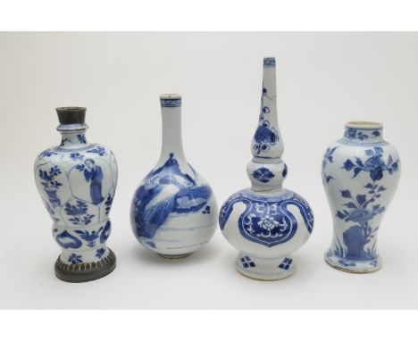 Four pieces of Chinese blue and white export ware, all Kangxi (1662-1722), comprising a mountainous landscape decorated bottl