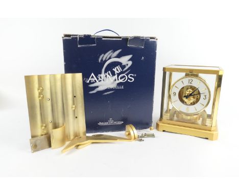 Jaeger LeCoultre brass Atmos clock, with Arabic and baton numerals, numbered 301306, height 23.5cm, width 21cm, complete with