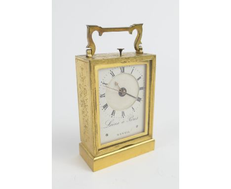 French brass travelling alarm clock by Laine a Paris, floral chased and brass case, the painted dial with Roman numerals, sig