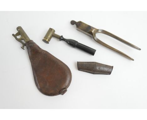 R Adams brass bullet mould, number 56, registered 1851, also a brass powder measure with turned wooden handle, a leather shot
