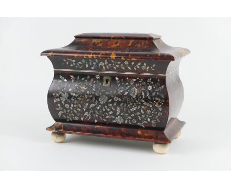 Regency tortoiseshell and mother of pearl inlaid tea caddy, circa 1810, sarcophagus form finely worked with birds amidst flow