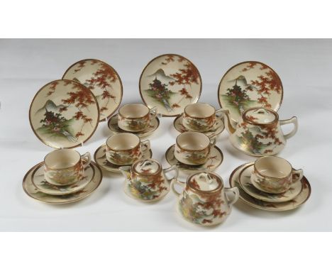 Japanese Satsuma tea service, Taisho (1912-26), decorated with pavilions within a mountainous landscape heightened with gilt,