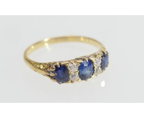 Sapphire and diamond cluster ring, set with three oval cut sapphires, the largest approx. 0.25ct, dispersed with four old rou