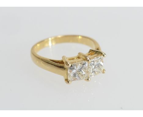 Diamond ring, set with two princess cut stones of approx. 1ct each, colour estimated as K/L, clarity as SI1/2, in 18ct yellow