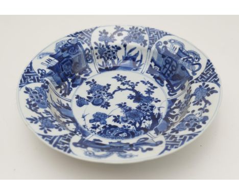 Chinese blue and white bowl, Kangxi (1662-1722), decorated with panels of prunus blossom and precious objects, unidentified m