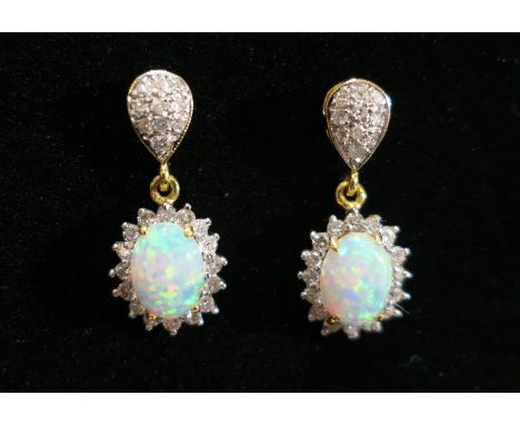 Pair of cabochon opal and diamond pendant earrings in unmarked yellow metal, 21mm drop, gross weight approx. 5.2g (Please not