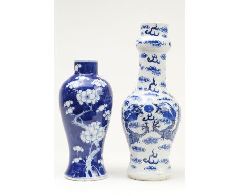 Chinese blue and white bottle vase, late 19th Century, decorated with scrolling dragons amidst clouds, painted four character