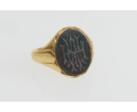 Gent's 18ct gold bloodstone signet ring, the intaglio carved with a monogram, size T, gross weight approx. 5.6g (Please note 