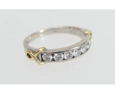 Diamond half eternity ring, set with seven brilliant cut diamonds totalling approx. 0.7ct channel set in platinum with yellow