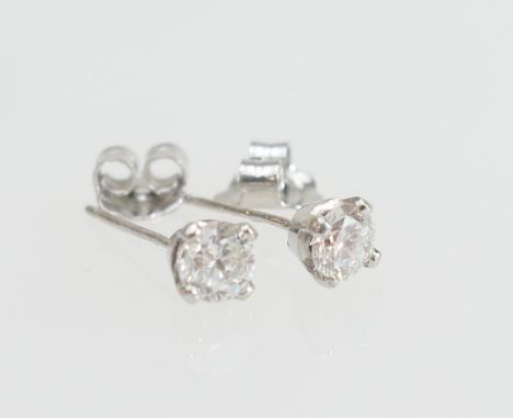 Pair of diamond ear studs, the brilliant cut stones estimated as 0.3ct, colour estimated as K/L and clarity SI2, in a platinu