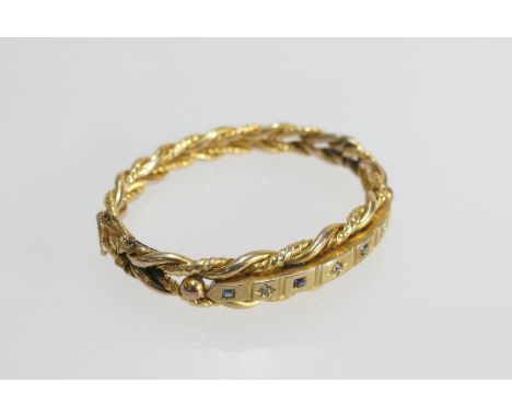 Late Victorian or Edwardian diamond and sapphire set gold plated hinged bangle, formed as double twist strands and set with s