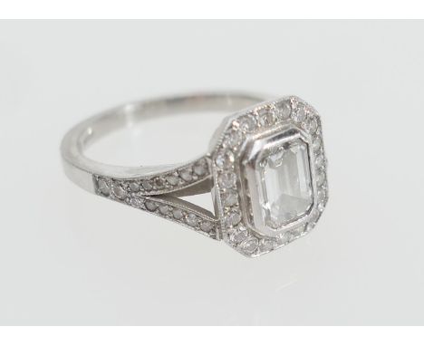 Diamond solitaire ring, the GIA certificated emerald cut diamond weighing 0.71ct, colour H, clarity VVS2, collet set in plati