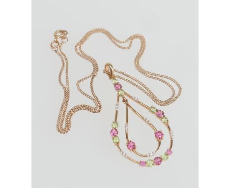 18ct rose gold pendant necklace, the pear shaped openwork double pendant set with diamonds, peridot and pink tourmaline, 45mm