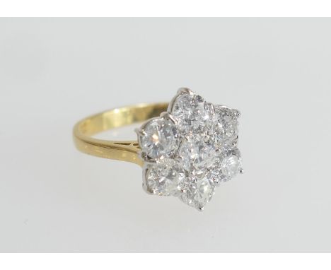 Diamond cluster ring, set with seven well matched brilliant cut diamonds in a flowerhead design, colour estimated as J/K and 