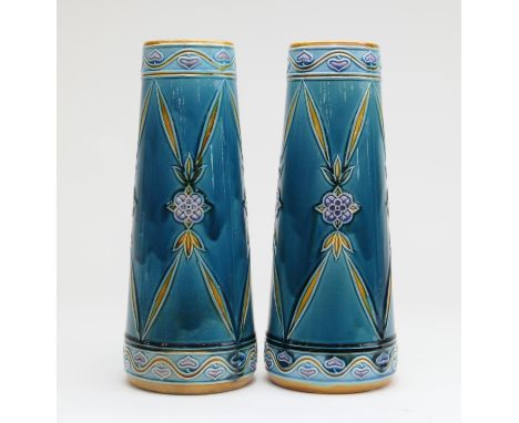 Pair of Minton Secessionist tapered vases, circa 1900, both having a floral open trellis design against a turquoise green gro