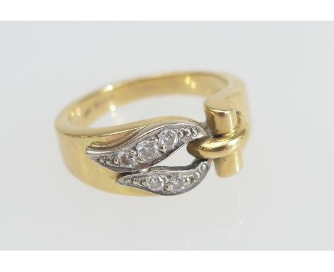 18ct gold and diamond belt type ring, set with five small round cut diamonds set in a loop in white gold against a yellow gol
