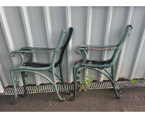 Two matching pairs of cast iron bench ends 