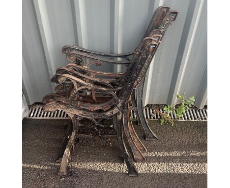 Pair of cast iron chair ends and one cast iron bench ends 