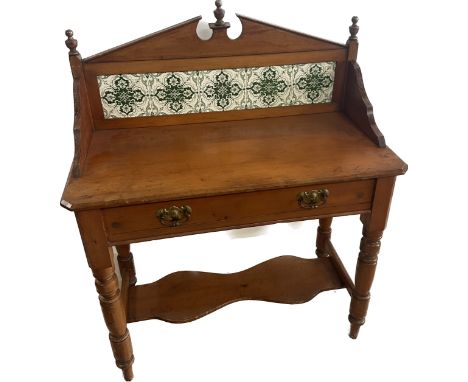 One drawer pine tile back wash stand measures approx 43 inches tall by 35 inches wide and 18 inches deep