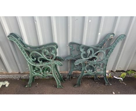 Two matching pairs of cast iron bench ends 