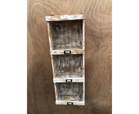 A VINTAGE STYLE THREE SECTION HANGING STORAGE UNIT 
