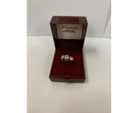 A BOXED SILVER THREE STONE RING 