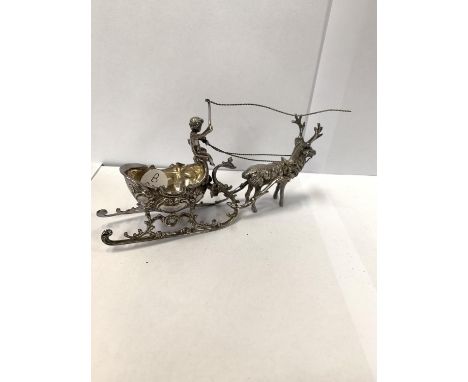A SILVER REINDEER AND SLAY MODEL 
