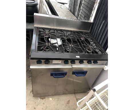 A SCOTT BENHAM SIX RING GAS COOKER IN WORKING ORDER 