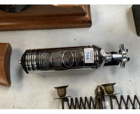 A VINTAGE CHROME FIRE EXTINGUISHER 