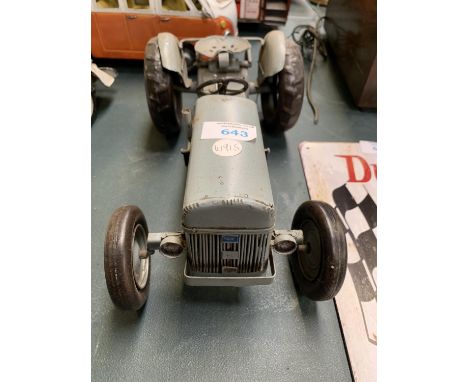 A TIN METAL TRACTOR MODEL 