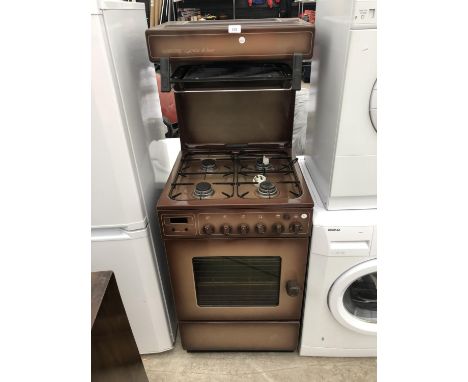 A FOUR RING GAS HOB AND OVEN IN WORKING ORDER 