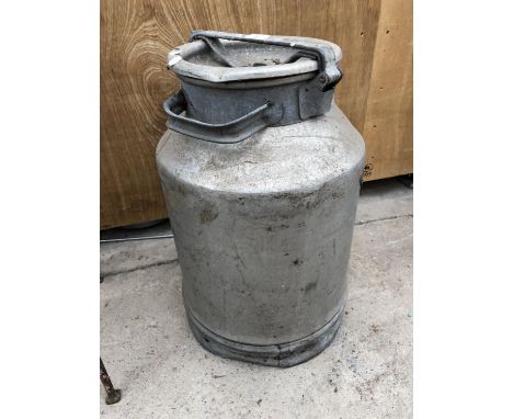 A VINTAGE METAL MILK CHURN 