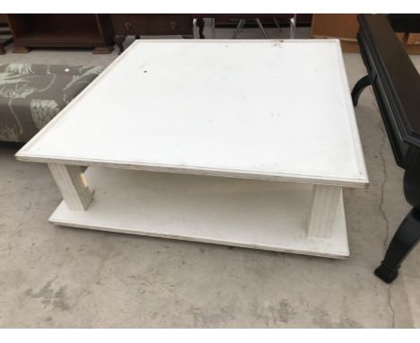 A MODERN WHITE SQUARE COFFEE TABLE WITH LOWER SHELF 