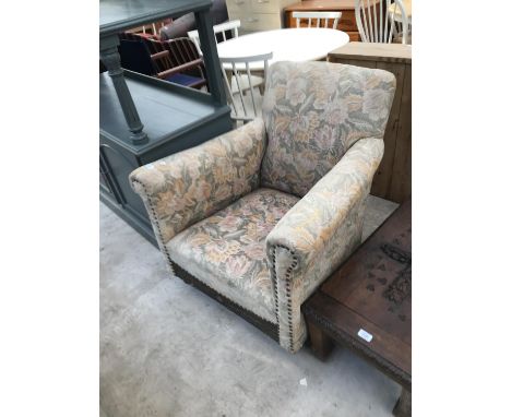 A VINTAGE FLORAL UPHOLSTERED PARLOUR CHAIR 