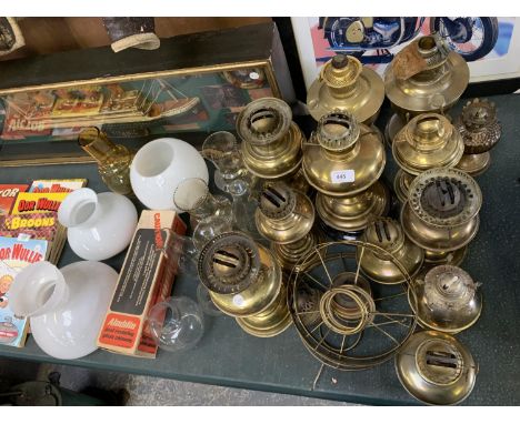 A LARGE COLLECTION OF OIL LAMPS AND OIL LAMP PARTS 