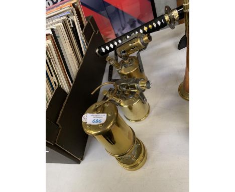 THREE ITEMS - TWO VINTAGE HAND HELD BURNERS AND BRASS MINERS LAMP 