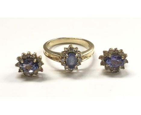 A TANZANITE JEWELLERY SUITE - COMPRISING RING AND EARRINGS, ALL SET IN 14CT YELLOW GOLD, STAMPED, GROSS WEIGHT 5.9G 