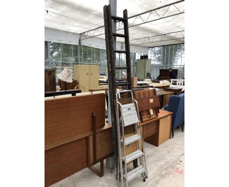 A LARGE VINTAGE WOODEN LADDER AND FURTHER METAL STEP LADDER 