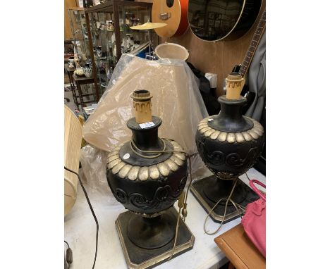 A PAIR OF TWO BLACK AND GOLD COLOURED ORNATE LAMP BASES TOGETHER WITH TWO SHADES 