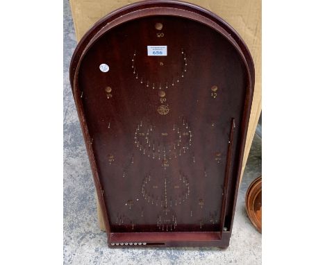 A WOODEN BAGATELLE BOARD GAME 