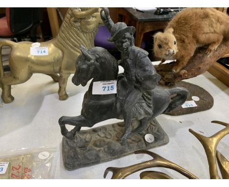 A VINTAGE METAL HORSE AND RIDER 