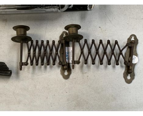 A PAIR OF VINTAGE BRASS CONCERTINA ACTION CANDLE HOLDERS 
