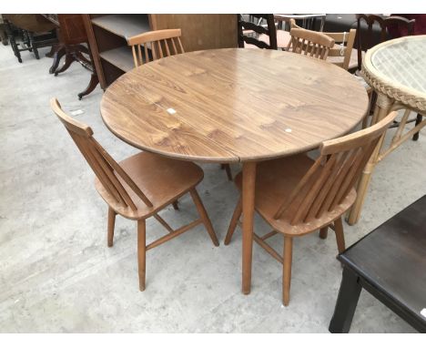 AN ERCOL STYLE ELM DINING TABLE AND FOUR DINING CHAIRS 