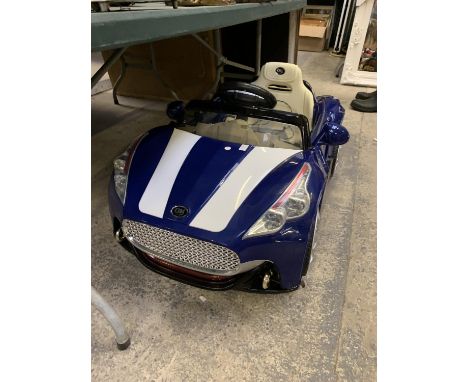 A CHILDREN'S BATTERY OPERATED CAR 