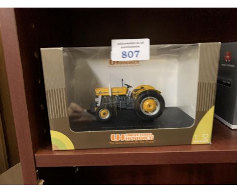 A UNIVERSAL HOBBIES MODEL MASSEY FERGUSON 135 INDSUTRIAL TRACOR, ITEM NO UH2872 BOXED 